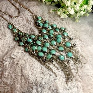 Silver tone necklace with faux green Gems
